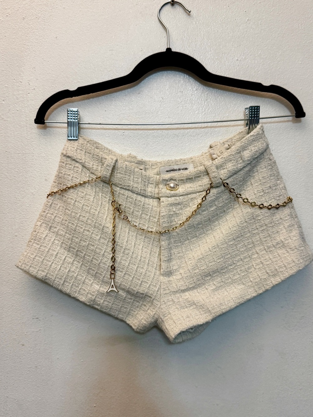 Maniere De Voir Cream Tweed High Waist Shorts with Gold Chain Accent